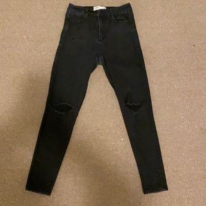 Black skinny jeans, two rips on knees and super cute! Super comfortable!